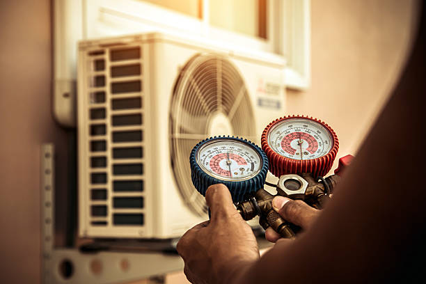Professional Air Conditioning Service technician working in Saint Cloud, WI